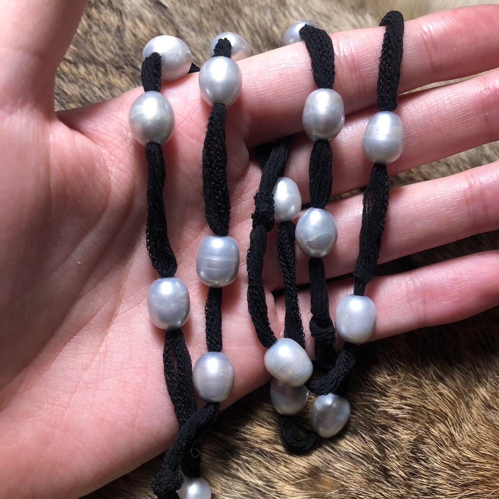 Handmade genuine gray pearl necklace strung on a black lacy fabric